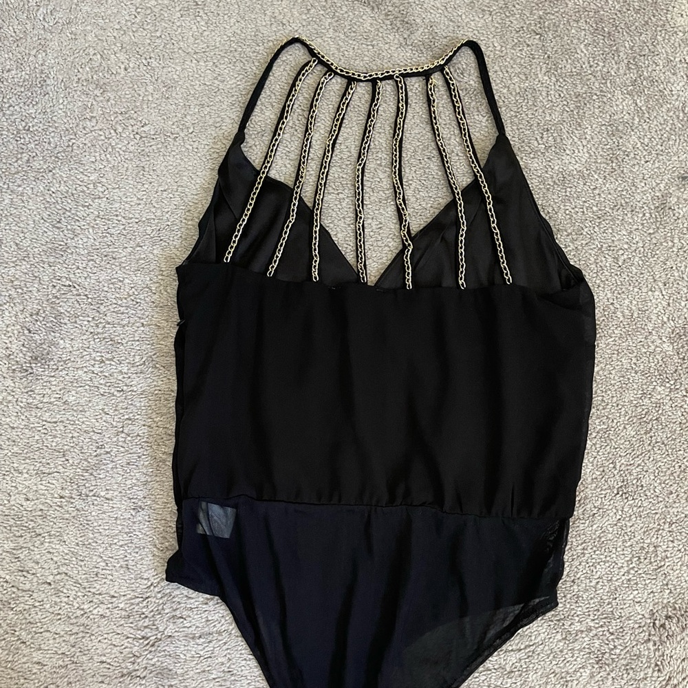 Black top with gold details